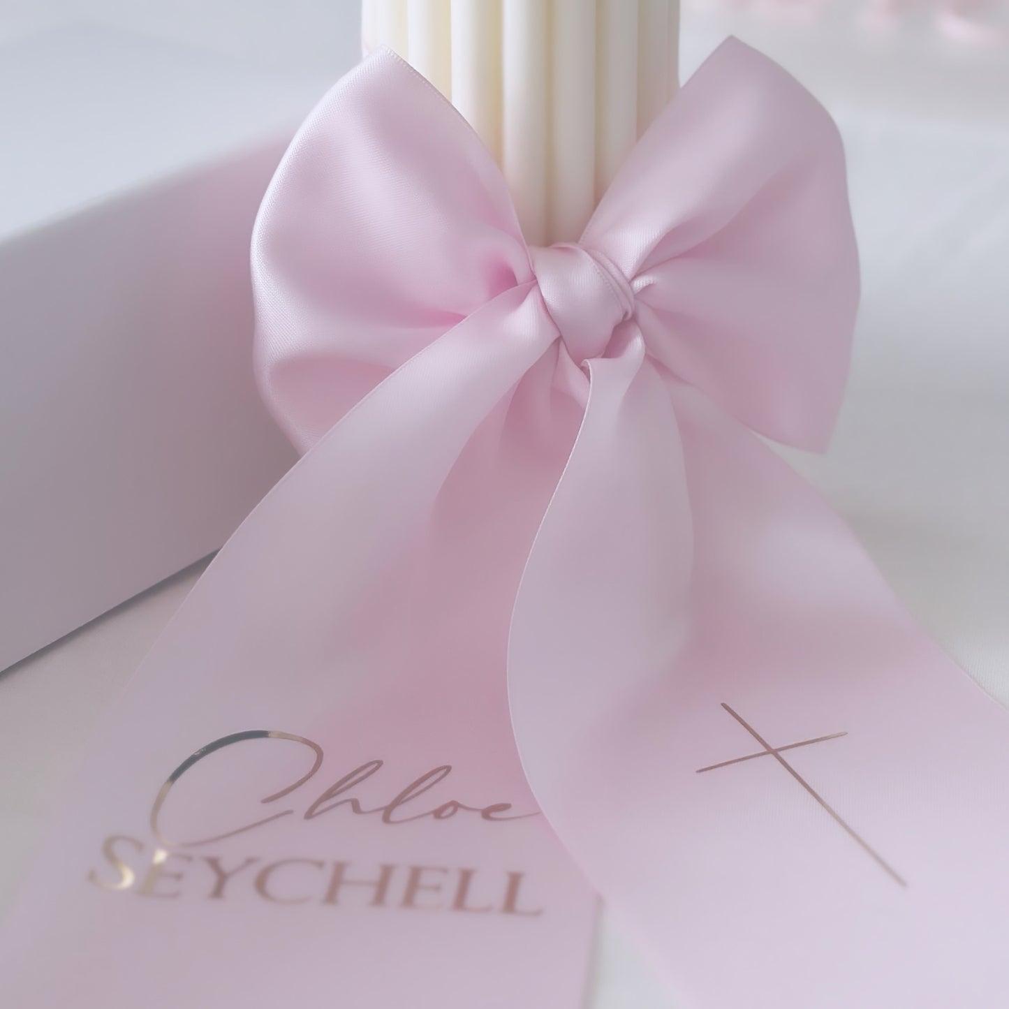 Baptism candle with text on satin bow