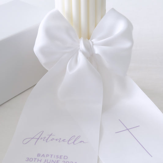 Baptism candle with text on satin bow